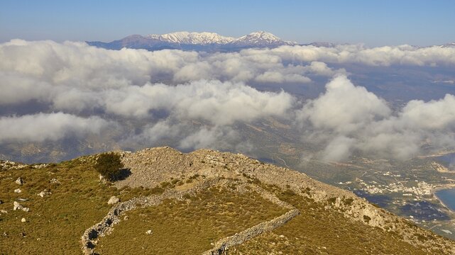 Spring in Crete, mountainside, stone walls, settlement, above the clouds, snow-capped mountains, Pachia Ammos, Mirabello Bay, Dikte Massif, Thripti Mountains, Thripti, north coast, east Crete, island of Crete, Greece