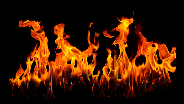Dramatic orange fire flames isolated on a black background, creating a powerful fire texture with glowing heat, dynamic movement, and intense energy for cinematic, dramatic, and creative designs.