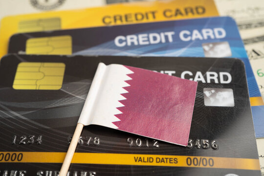 Qatar flag on credit card, finance economy trading shopping online business.