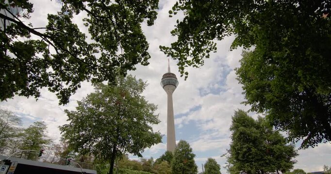 Rhine Dusseldorf TV tower Germany modern architecture dominates an urban cityscape surrounded by contemporary skyscrapers glass buildings and European travel landmarks 
