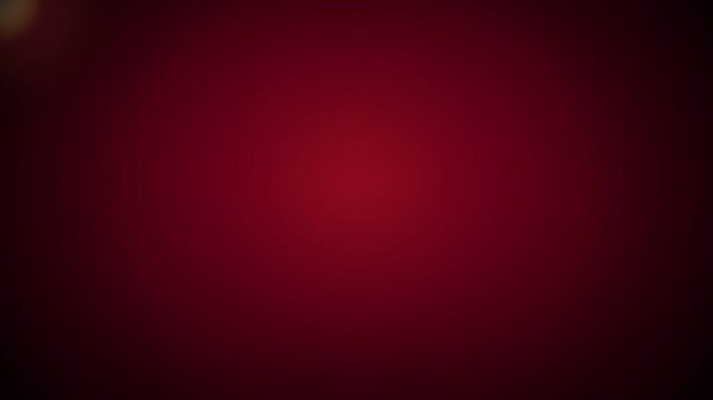 Abstract deep red vignette background featuring subtle light leak reflections, soft gradient glow, smooth motion blur texture, ideal for romantic video overlay, luxury backdrop, and motion graphic.