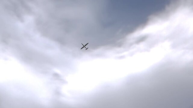 Hornet Kamikaze Fixed Wing AI-Assisted Drone Flying Overhead. UAV Unmanned Aerial Vehicle. Modern Technology Warfare in the Air. 3D Render.
