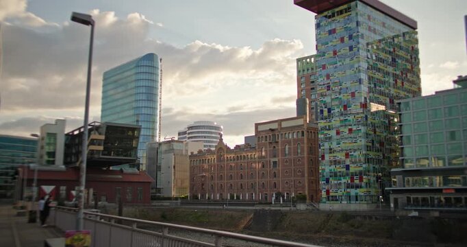 Sunset Dusseldorf Germany modern waterfront architecture and urban cityscape of the old Rhine harbor with contemporary buildings for European tourism