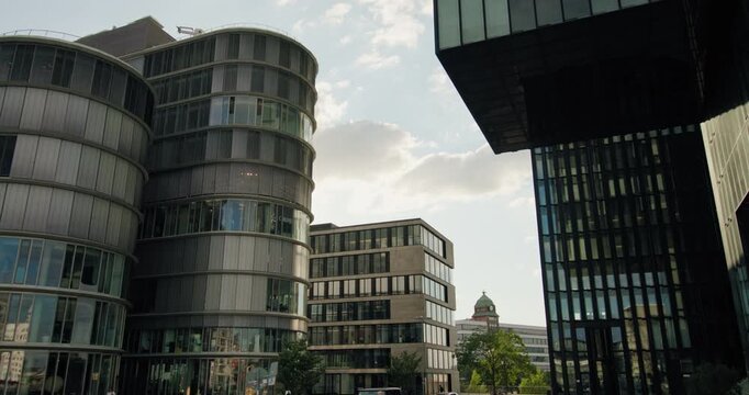 Urban cityscape Dusseldorf modern architecture office district Germany features glass towers and high rise buildings representing contemporary European travel tourism