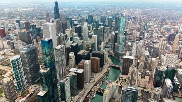 High-altitude aerial drone view of the skyscrapers of the downtown loop and the river with its many bridges, Chicago, United States