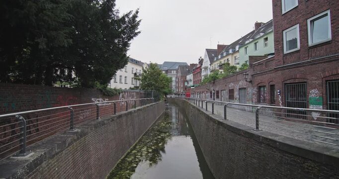 Dusseldorf Nordliche Dussel Germany canal cityscape presents historic architecture and famous urban landmarks along a scenic waterway during travel through Europe.
