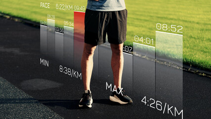 Obraz premium Sports performance data displayed on a track with a person standing nearby during a training session