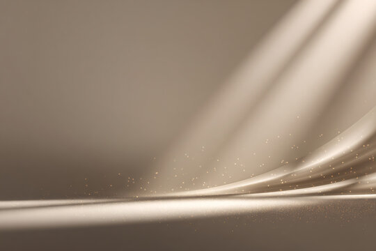 Abstract beige backdrop with light rays and golden glitter dust
