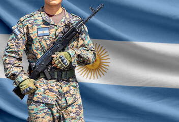 Obraz premium Argentina flag with soldier holding assault rifle