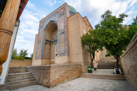 Shah-i-Zinda necropolis in Samarkand, Uzbekistan. Avenue of mausoleums with blue tile domes. Ancient stairway. Timurid and Karakhanid architecture.