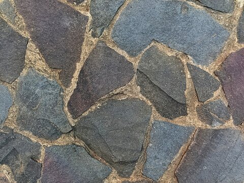 Natural stone pavement texture background top view close up
