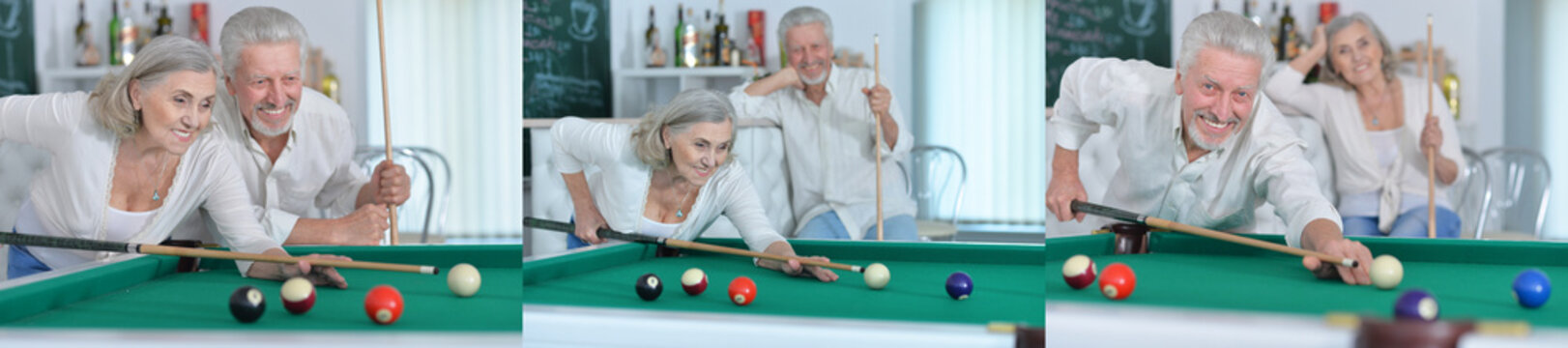 Senior couple playing billiards in a recreation room