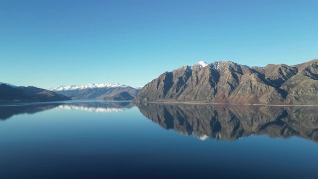 Mountain landscapes around Lake Wanaka showcase the Southern Alps of New Zealand with dramatic peaks and tranquil nature scenery across a beautiful Pacific island destination