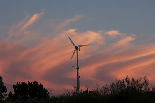 wind turbine at pink sunset