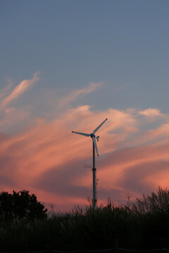 wind turbine at pink sunset