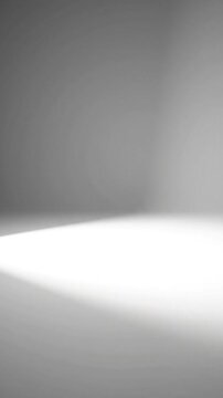 Cinematic spotlight illuminating empty studio floor with dramatic white light beam animation for professional product display and minimalist background footage