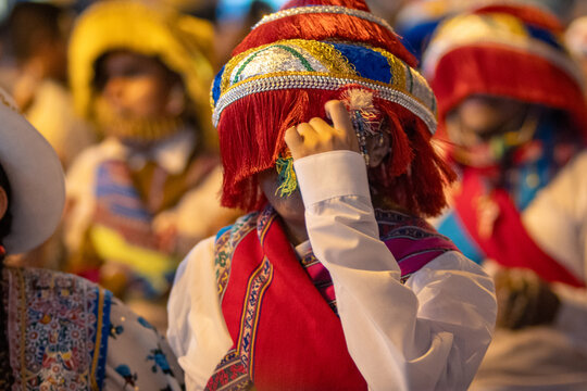 Close Up Details of Dancers in Colorful Traditional Costumes and Masks at a Peruvian Folk Dance Festival Parade