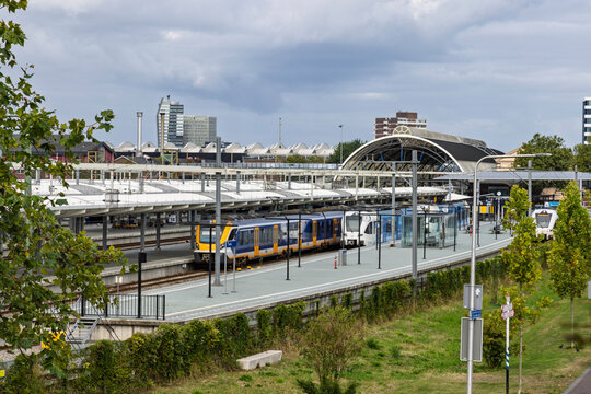Zwolle, Netherlands - 23 August 2026: Elevated view of the Zwolle railway station showing passenger trains at the platforms and the modern curved roof structure.