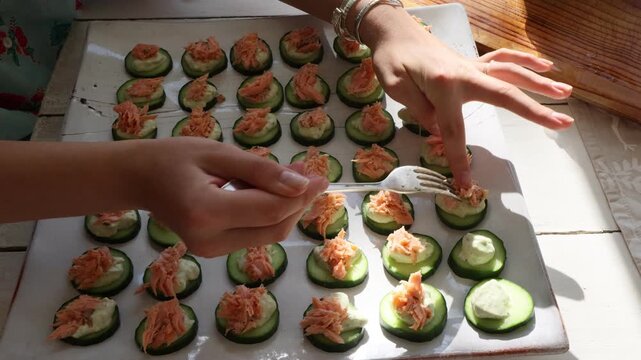 woman preparing Canapes as appetizer