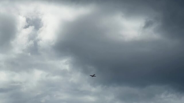 Vintage Spitfire Warbird Flying Through Cloudy Sky at Gold Coast Air Show