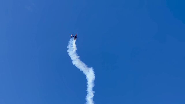 Stunt Plane Performing Aerobatic Loop with Smoke Trail at Gold Coast Pacific Airshow