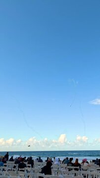 Crowd Watching Airshow Smoke Trails at Surfers Paradise Beach