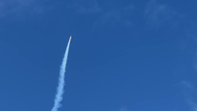 Stunt Plane Performing Aerobatics with Smoke Trails at Pacific Airshow Gold Coast