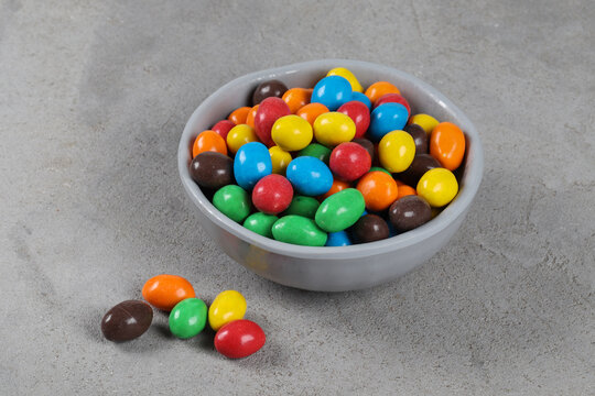 Crispy multicolored Peanut Dragees. In a bowl. Close-up