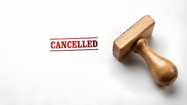 Cancelled text stamped in red ink with a wooden rubber stamp isolated on white background
