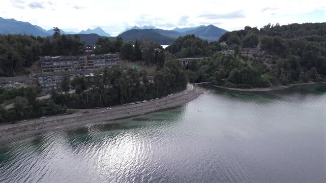 4K drone aerial view of the bridge between Lake Correntoso and Lake Nahuel Huapi in Neuqu&eacute;n, Argentina. The scenic road connects two Patagonian lakes surrounded by forests and mountains.