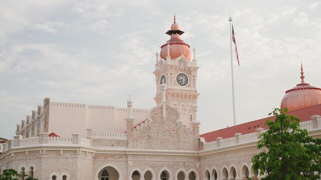 Sultan abdul samad building clock tower waving flag