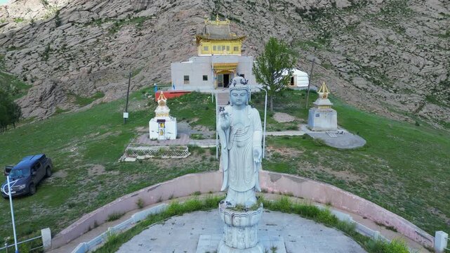 Buddha statue greets visitors to golden Galdan Zuu Temple, Mongolia