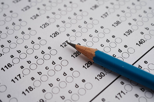 Answer sheets with pencil drawing fill to select choice, education concept.