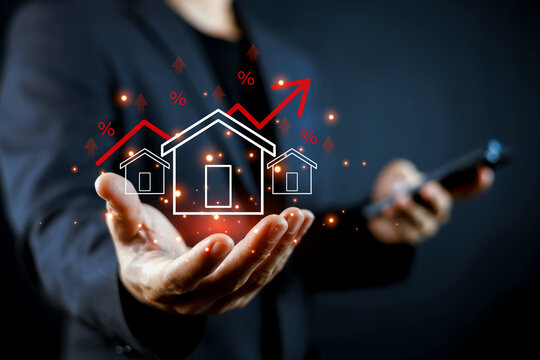 Real estate investment concept showing a professional presenting a glowing house with rising red arrows and percentage symbols, symbolizing property growth, home value, finance, and investment.