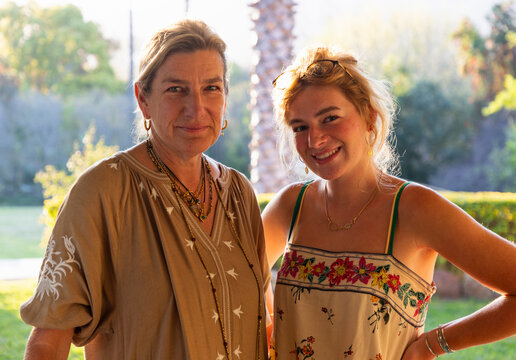 portrait of mother and 20 year old daughter in natural light smiling