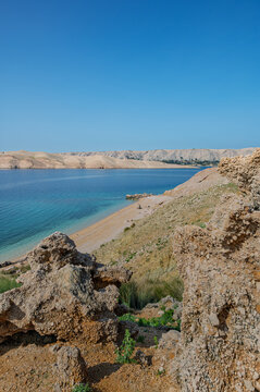 Turquoise waters of the Malin Beach located on Pag Island, Croatia