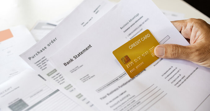 close-up shot, asian man doing online business, E-commerce checking bank statement and order before using credit card to payment