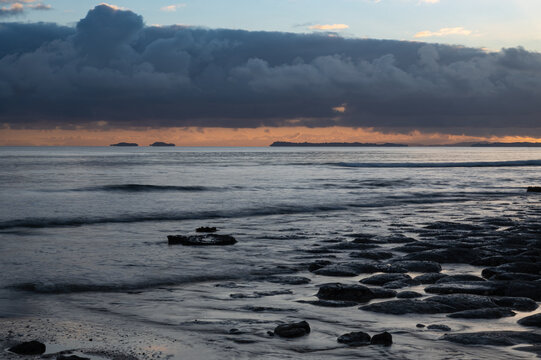 View out towards the Hauraki Gulf from Long Bay beach, Auckland, New Zealand