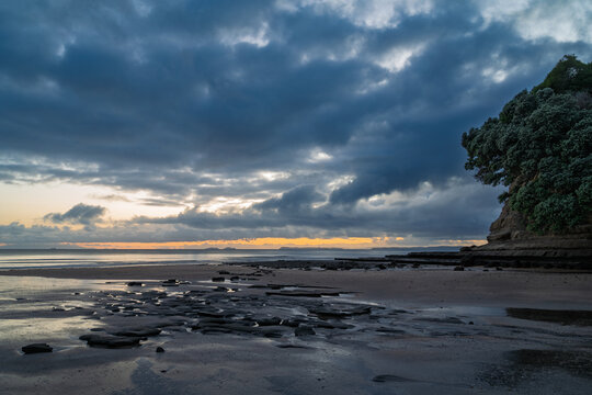 Morning blue hour at Long Bay beach, Auckland, New Zealand