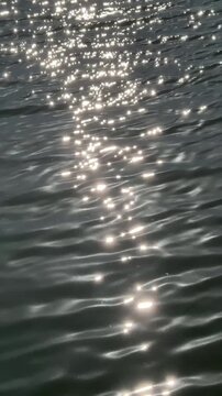 Silvery waves on the water, shimmering and glistening with the sun&rsquo;s rays.