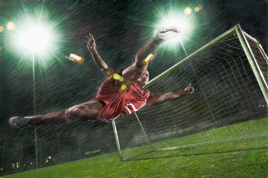football player makes spectaculary sideways scissor-kick