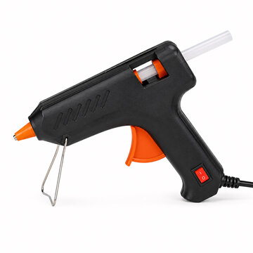 Black hot melt glue gun with orange trigger and white glue stick