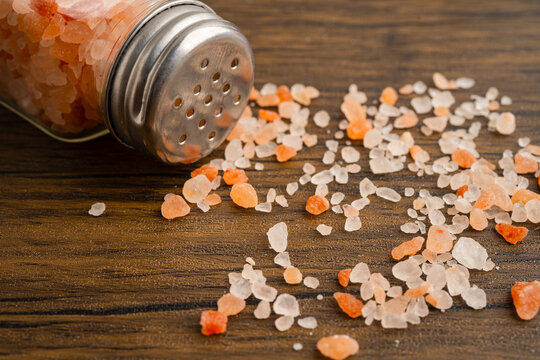 Sodium chloride Himalayan pink salt with salt shaker.