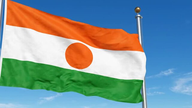 Niger flag waving in the wind against a clear blue sky background