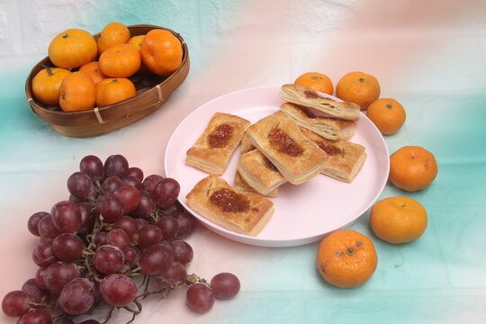 christmas cookies and fruit on table