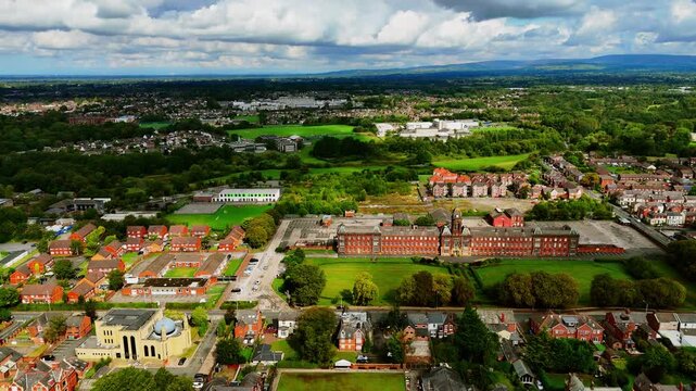 Sunny aerial shot over Fulwood business centre, mosque and residential Preston England