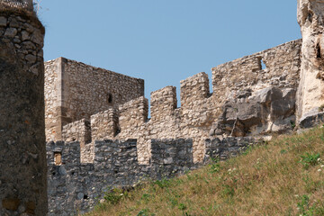 spis castle ruins stone wall battlements medieval fortress slovakia clear blue sky grassy hillside historic landmark concept of travel, history, tourism © Lana Pietukhova