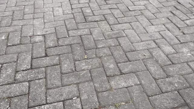 Cinematic Panning Shot of Grey Paving Blocks Texture