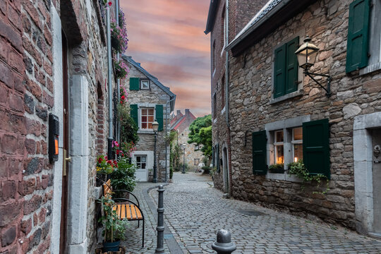 Historic cobblestone street in Stolberg city center at sunset