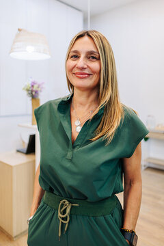 The confident cosmetologist welcomes clients to the beauty clinic
